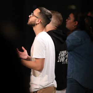 Young man worshiping God