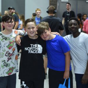 Young Teen age boys hugging and smiling